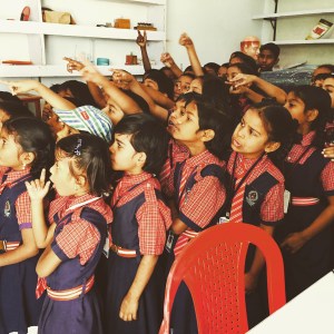 all of these adorable children are going to want to shake your hand. do it, but make sure you wash up properly after. hyderabad, india. february 2015.