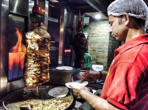 enjoying a roll at fanoo's. bangalore, india. march 2015.