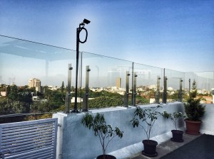 enjoying a view of the city center from the terrace garden at st marks hotel. bangalore, india. march 2015.
