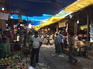 strolling through crawford market on a sunday morning. bombay, india. may 2015.