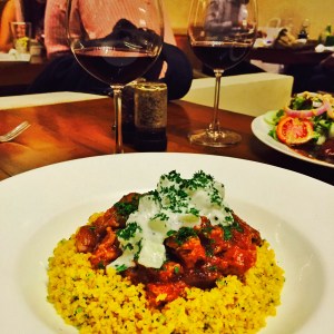 lamb shanks, couscous, and a glass of red wine. now that's what i call a good night. bombay, india. may 2015.