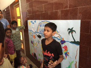 govind explaining our mural to the parents. bombay, india. may 2015.