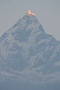 watching the sun rise over fishtail and the annapurna range. sarangkot, nepal. october 2012.