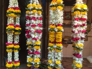 all the garlands lined up and ready for celebrations. bombay, india. may 2015.