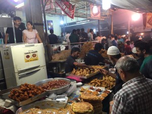 checking out the desserts at the charminar stall. bangalore, india. july 2015.