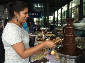 having fun at the chocolate fountain. bangalore, india. september 2015.